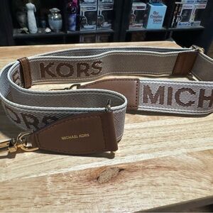 EUC - Michael Kors Brown guitar strap gold hardware